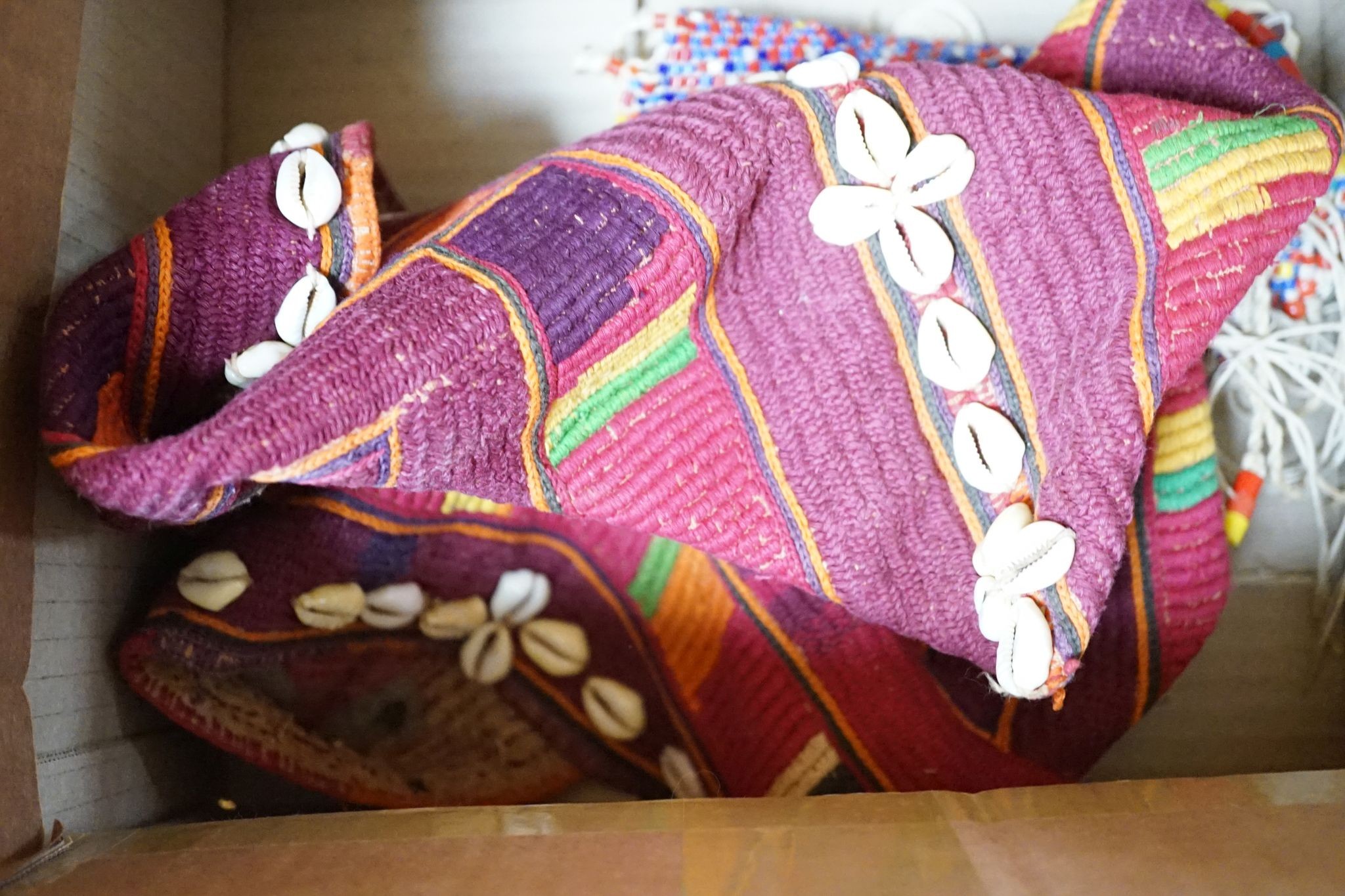 A large African beadwork necklace and three beadwork bags